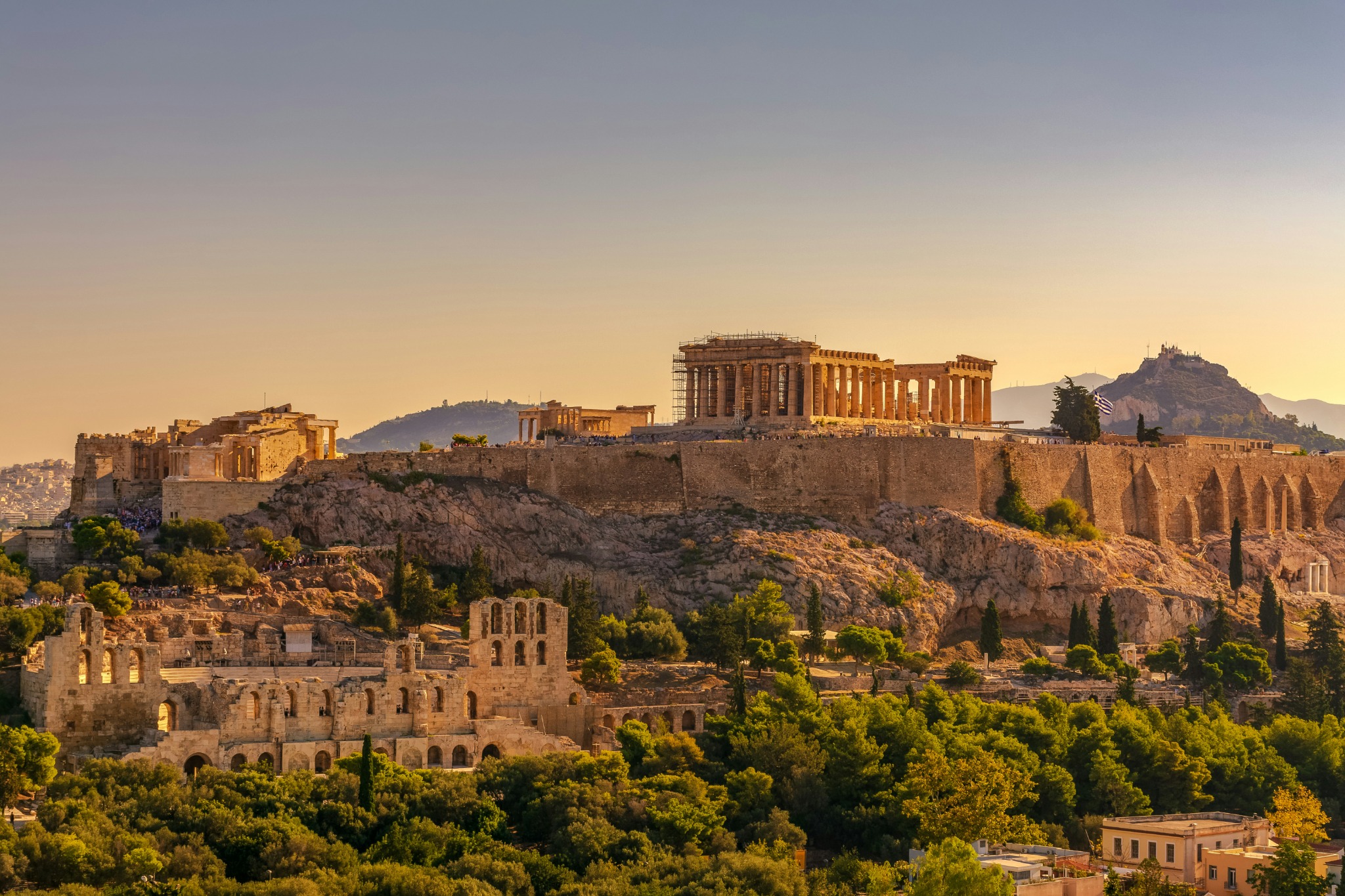 Sunlit view across the Acropolis and surrounding Athens cityscape